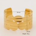 Detail shot of wide golden stainless steel cuff bracelet with 35mm width and 46g weight - Wave Stripe Style (1169)