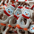 Funny penguin baby teether with Christmas hat and red scarf for easy infant gripping - Penguin Teether / Apricot