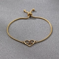 Detailed view of gold heart and heartbeat charm on an adjustable stainless steel box chain - Gold Heartbeat Heart