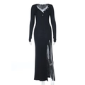 Detail of black ribbed knit dress featuring elegant lace trim V-neck and decorative buttons - S / Black
