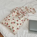 Detailed view of canvas tote bag with red cherry print and ruffle chiffon trim textures - Cherry Embroidery Beige