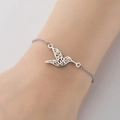 Bracelet colibri élégant en finition argentée sur le poignet pour un style rétro chic - Couleur Acier