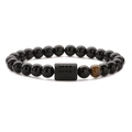 Detail of beaded men's bracelet with black obsidian, tiger eye stone and carved cylinder - Aquarius