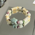 Ceramic beaded bracelet with green star charm and white cube beads on mirror surface - Wanxing (1007-02挽星)