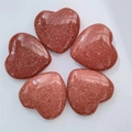 Set of five heart-shaped red-brown goldstone crystals with sparkling finish on white - Goldstone (Synthetic)