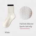White non-slip yoga socks with black ribbed cuffs and full-sole silicone grips - One Size / White