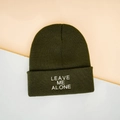 Olive green knit beanie with Leave Me Alone embroidery on a minimal aesthetic background - One Size / Army Green