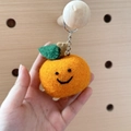 Handmade orange wool felt fruit keychain with a cute smiling face and green leaf - Big Orange