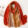 Detailed view of patterned cotton linen scarf with floral motifs and elegant tassels - Orange and Khaki