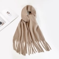 Detail view of a beige mohair scarf featuring long tassels and soft plush texture - Khaki