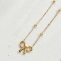 Elegante goldene Halskette mit Schleifenanhänger und kleinen Perlen auf feiner Kette - Glatte Doppelschleife (Planetenkette)