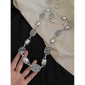 Detailed macro view of silver leaf-style metal waist chain featuring textured oval links - Silver Oval Textured Style