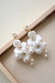 Detail of white ceramic flower hair pins with pearl accents and gold metal finish - Gold Earrings Pair