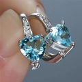 Macro detail of heart-shaped light blue gemstone earrings with sparkling cubic zirconia accents - Platinum Plated Aquamarine Zircon