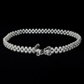 Macro detail of elastic pearl waist belt featuring a rhinestone silver bow buckle - Silver Bow Rhinestone Buckle Ornament (Style 18)