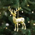 Golden reindeer Christmas tree ornament with intricate textures and hanging string - Looking Elk