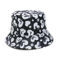 Close-up of black canvas bucket hat with white hand-drawn heart and dot prints - Black