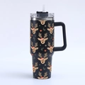 Macro detail of 40oz black stainless steel tumbler featuring festive reindeer patterns - Black Christmas Elk