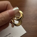 Pair of gold S925 sterling silver U-shaped crescent hoop earrings on wooden background - Gold