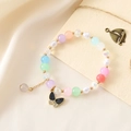 Multicolor beaded bracelet with a black butterfly charm and elegant golden accents - Colorful Bead Bracelet + Butterfly (K3509)