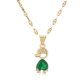 Golden necklace with zircon boy pendant and heart-shaped green gemstone on white background - Green