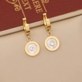Macro detail of gold hoop earring featuring Roman numerals and zircon shell inlay - Gold Earrings