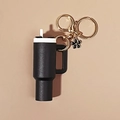 Mini black tumbler cup keychain with gold ring and elegant black flower charm accessory - Black