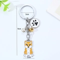 Detailansicht Shiba Inu Schlüsselanhänger mit 3cm Ring, 9cm Länge und süßen Glocken - Cartoon Shiba Inu Akita Pfote