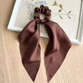 Close-up of a dark brown satin scrunchie with long ribbons on a wooden surface - Dark Coffee