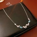 Detail of silver butterfly necklace with blue oval gems and zircons on display box - 11# Silver Blue Butterfly Necklace