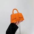 Mini orange beaded chain handbag with lychee texture leather and trapezoid shape - Orange