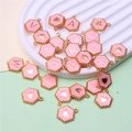 Flat lay of pink enamel hexagon letter charms and gold metal heart pendants for DIY jewelry - Hexagon Alphabet Set (DY147) / Set of 26 / Style 60 Pink Hexagon
