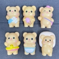 Set of 6 cute cream bear squishy toys in various outfits on grey textured fabric - Yellow Bear Large 11cm