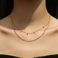 Double-layered 18k gold titanium necklace with rhombus sequins on a female model - Rhombus Sequin Double Layer / 18K Gold / Gold