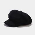 Close-up of black corduroy newsboy cap showing detailed ribbed texture and octagonal shape - Black