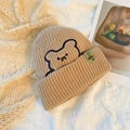 Winter khaki knitted beanie with bear embroidery and green label on lace background - One Size / Khaki