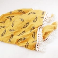 Close-up of ginger muslin baby blanket with black feathers, lace edges and tassels - Custom Size / Khaki