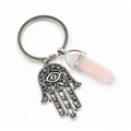 Detail of Hamsa Hand charm with evil eye and pink hexagonal crystal pillar keychain - Rose Quartz