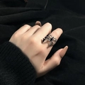Unique silver spider-shaped ring with black zircon stone on model's hand - Style 10 Adjustable Ring