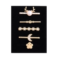 Close-up of five-piece golden alloy decorative rings with pearls and rhinestones - Deer Head Flower and Moon Design (D3013) / Black Sponge Packaging