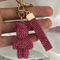 Pink rhinestone bear keychain with matching glitter strap and golden metal clasp - Rose Red