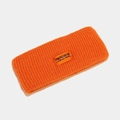 Detail of a bright orange ribbed knit headband featuring a central woven logo label - One Size / Orange