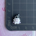 Detailed view of tiny resin ghost with wizard hat on a ruler showing 1.5cm size - Black Star Hat Ghost