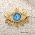 Detail view of gold evil eye pendant with crystal stars and measurements 3.8cm by 3.3cm - A0251