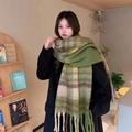 Thick mohair checkered scarf with tassels in green and white, styled on a model indoors - Green