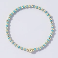 Handmade bohemian beaded bracelet featuring light blue and gold beads in a minimalist design - Blue and Gold