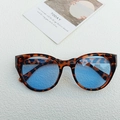 Chic cat eye sunglasses featuring leopard print frames and light blue transparent lenses - Leopard Frame Blue Lens