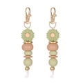 Detail of beaded daisy keychain with green flower bead and gold metal clasp on white - Green