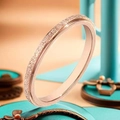 Macro shot of rose gold matte texture finish on a slender titanium steel band - US 5 / 2mm Width / Rose Gold