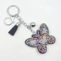 Sparkling butterfly keychain with colorful rhinestones on black base and a black tassel - Multi-color